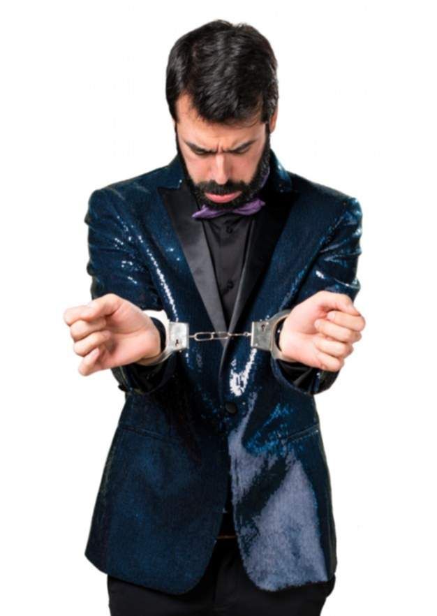 handsome-man-with-sequin-jacket-with-handcuffs_1368-8188